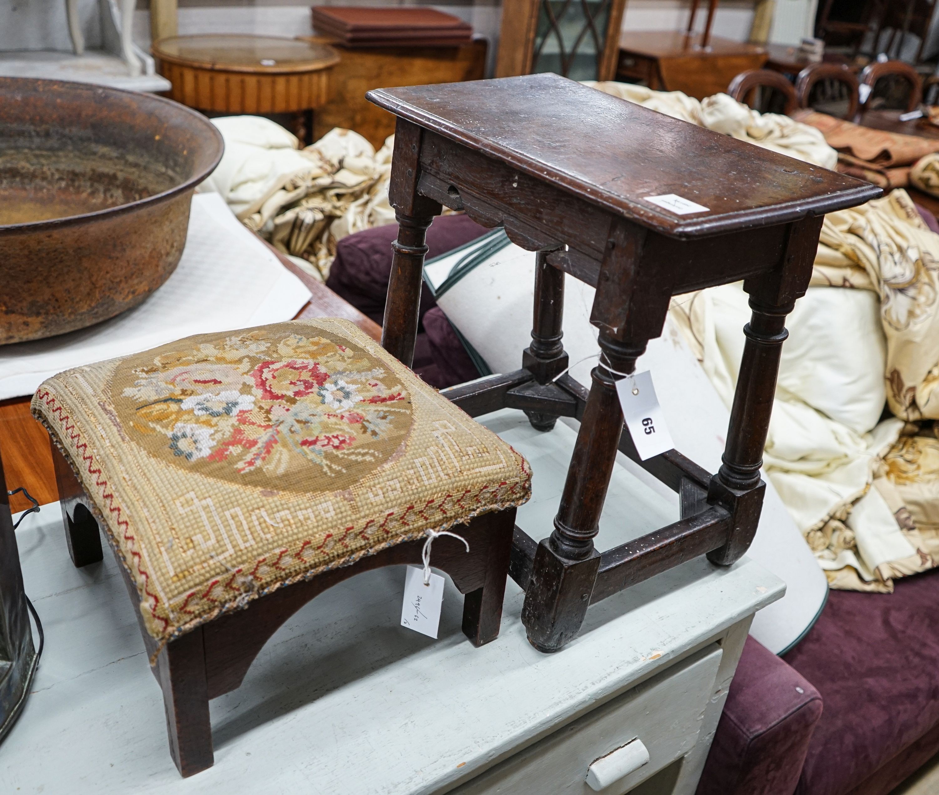 A 17th century style oak joint stool, width 46cm, depth 26cm, height 46cm and a George III stool with Victorian needlework seat, length 33cm